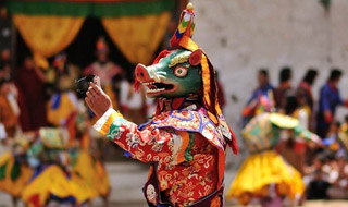 Masked dancer performing in a festival